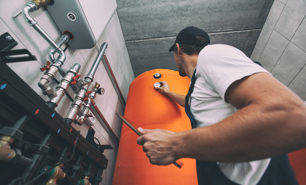 The,Technician,Checking,The,Heating,System,In,The,Boiler,Room