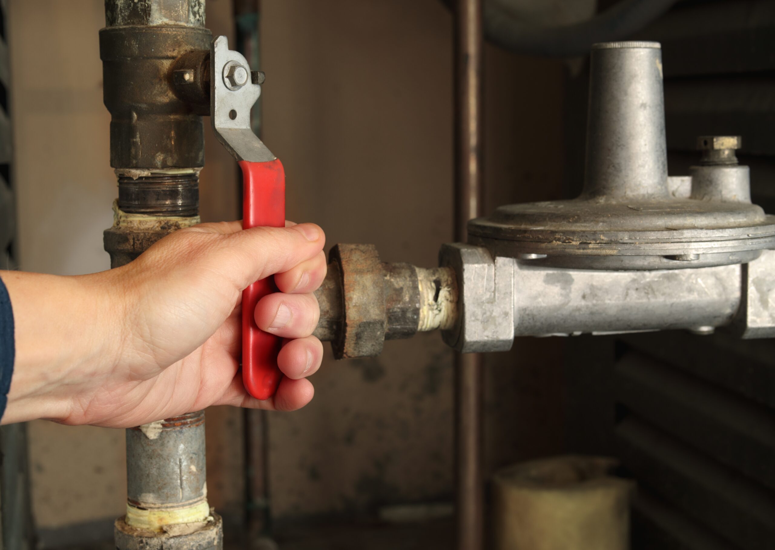 Technician,Using,Gas,Shut-off,Valve,In,Front,Of,Gas,Pressure